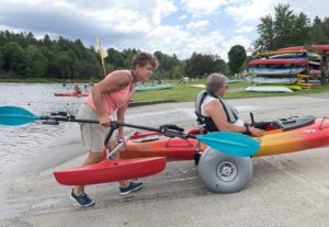 Cathy uses adaptive equipment, including these large wheels to get people in the water.