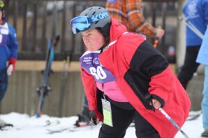 Young skier athlete gives it all at the Vermont Special Olympics.