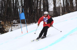 Skier athlete showing skills in the race course at the Special Olympics.
