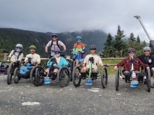 Adaptive bike riders celebrate at the summit of Mt. Mansfield in the Race to the Top of Vermont.