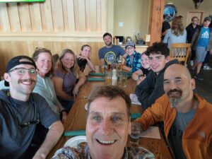 Group of adaptive athletes enjoying dinner at the Trapp Bierhall in Stowe