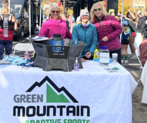 Volunteers at the GMAS Tent greet the racers