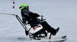 Skier controlling the TetraSki with a Joystick