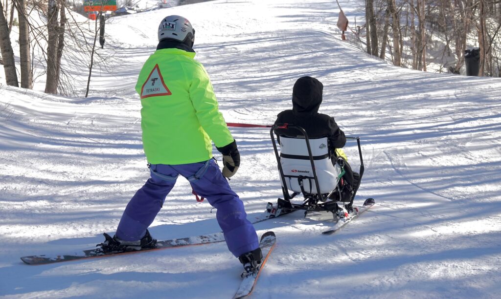 Tom Hall and Amy enjoying their time skiing in the Snow'Kart.