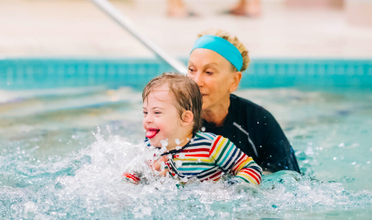 Young Child with his swim instructor