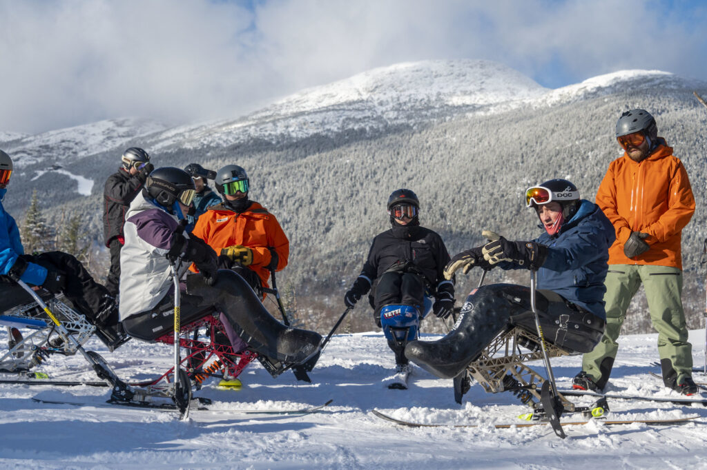 A group of monoskiers take part in a clinic at Stowe led by Chris Young. Photo: Jeb Wallace-Brodeur