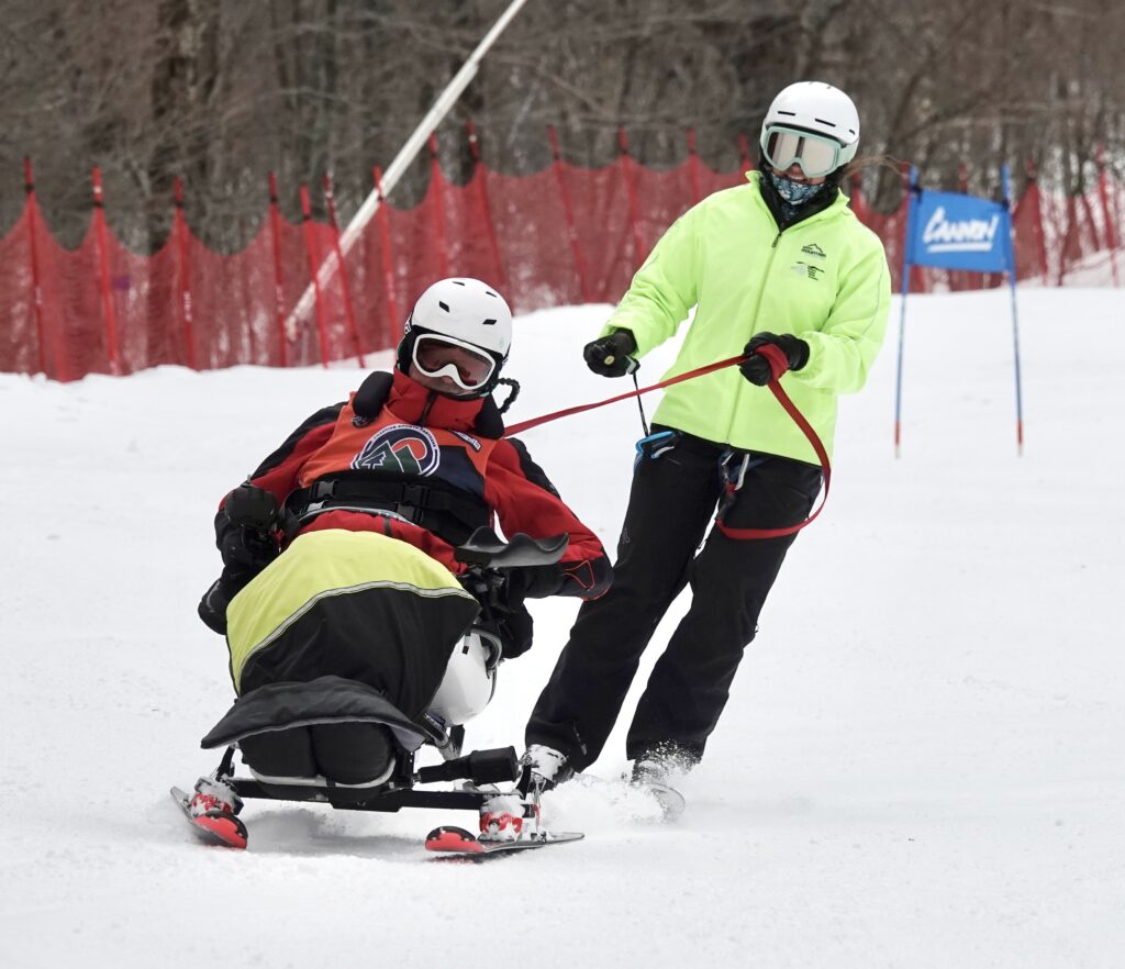 Dave Whalen skiing with Allie Peterson.
