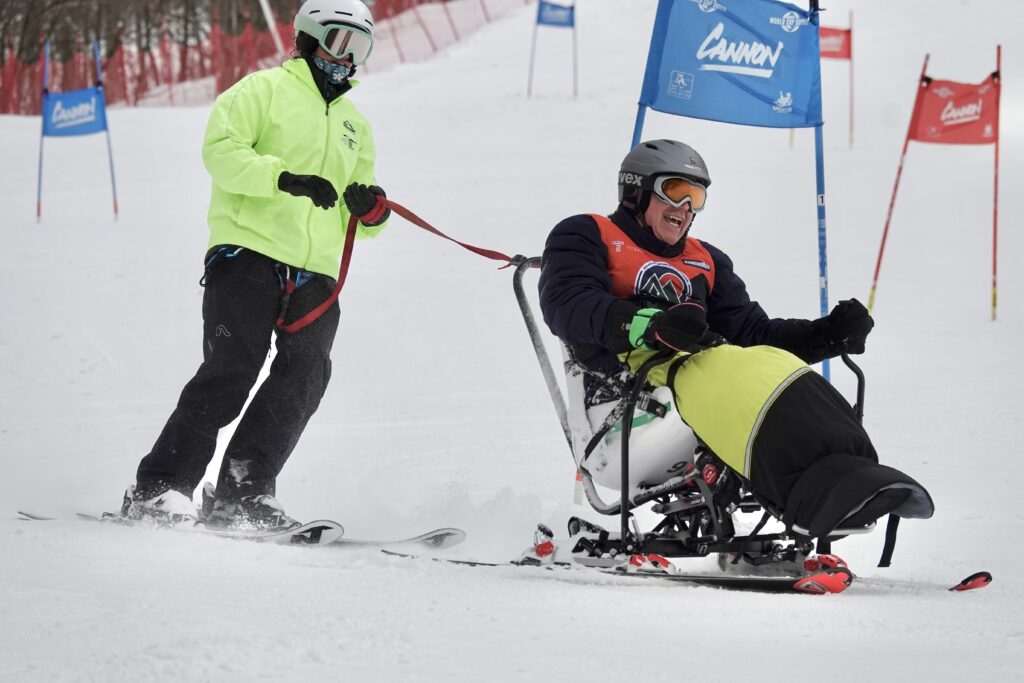 Mike Fay skiing with Allie Peterson.