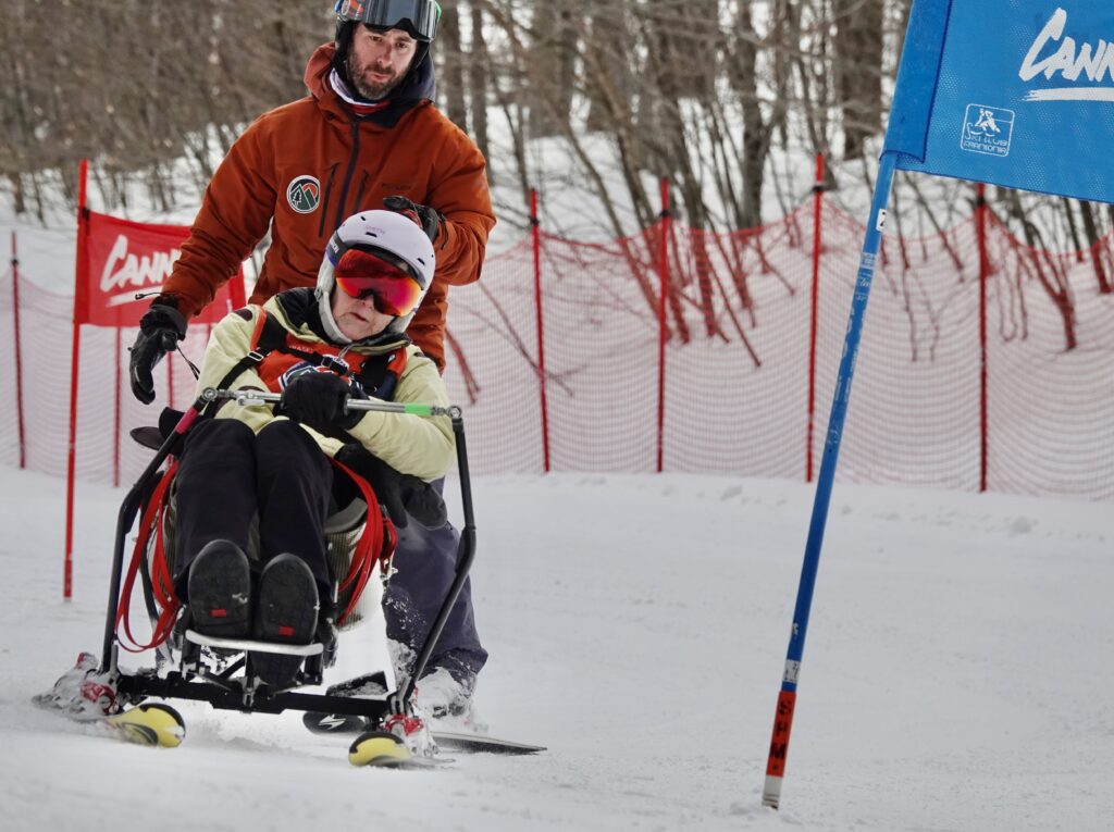 Rachel McKnight in the Snow"Kart with Nate Hanson.